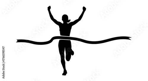Triumphant runner breaks finish line tape with arms raised in celebration of victory and achievement