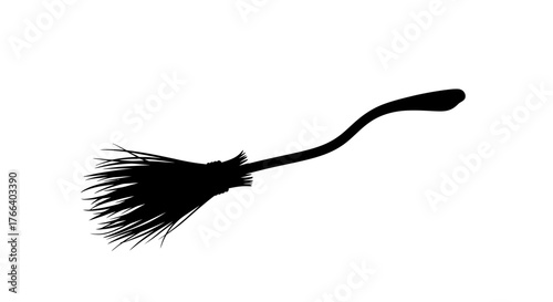 Magical silhouette of a broomstick flying against a white background