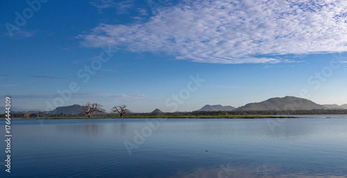 clouds over lake with mountains landscape , Sri Lanka, Thissa wewa