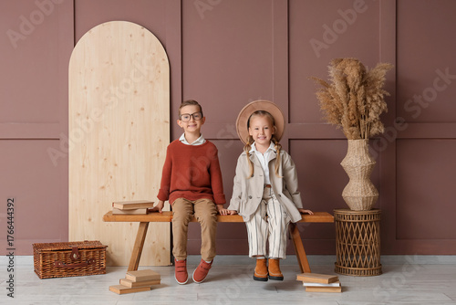 Stylish little children sit...