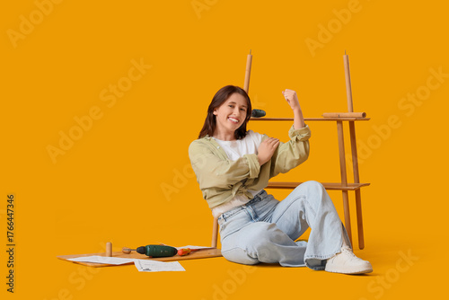 Young woman assembling shel...