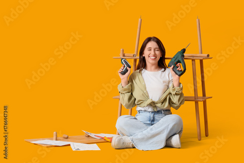 Young woman with tools asse...