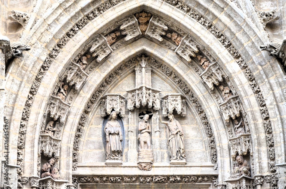 Fototapeta premium Detail of the Door of the Baptism at the world largest gothic cathedral in Seville, Spain
