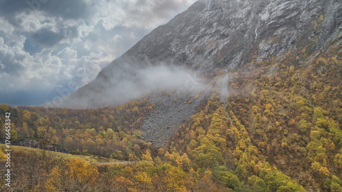 Fotografie Autumn landscape in Norway with colorful foliage and fog on the mountainside
