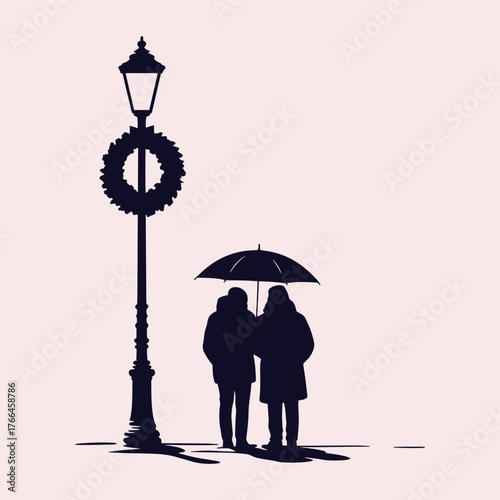 Silhouette of two people sharing an umbrella next to a lamppost with a wreath couple