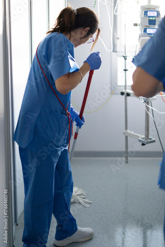 Medical professional cleaning hospital floor for hygiene