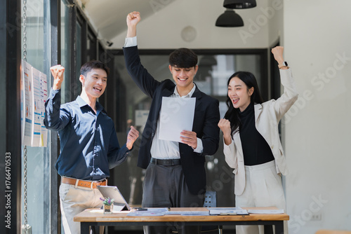 Business team celebrating success achieving common goal