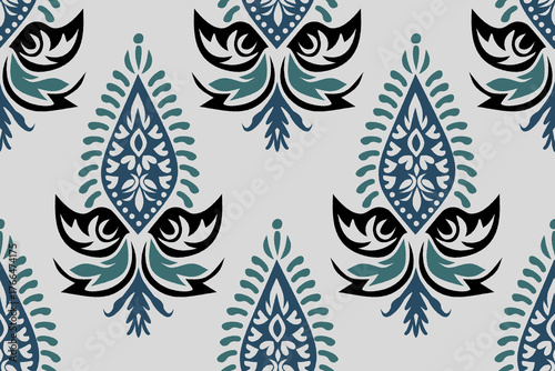 Stylish ikat seamless pattern featuring floral and leaf motifs in Blue and Teal. Modern ethnic-inspired pattern blends traditional craftsmanship. Perfect for fabric prints, wallpapers, home decor