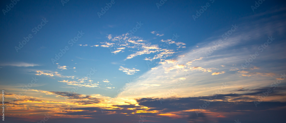 Fototapeta premium Beautiful sunset sky background with tiny clouds. Panoramic view.