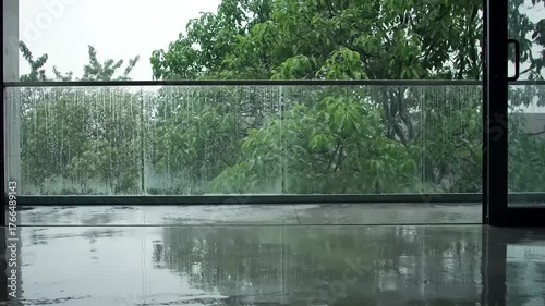 Rainy Day View from Modern Loft Balcony with Glass Railing