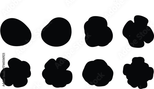 Vector art of set of eight black irregular blob shapes