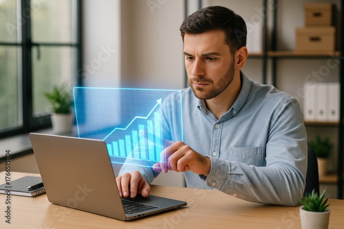 Man working with futuristic holographic chart on laptop