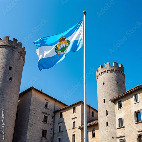 Flag Of San Marino Flying Between Two Castle Towers Under A Bright Blue Sky
