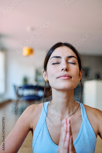 Free Download Portrait of a fit black girl young woman exercising practicing yoga or fitness at home - GFXLoad