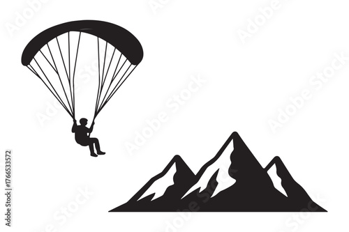 paraglider silhouette on the mountain