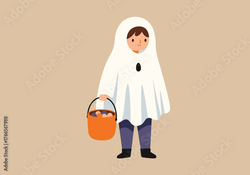 Adorable child in a simple white sheet ghost costume holding an orange bucket full of candy for a fun halloween celebration