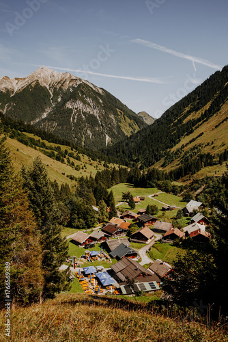 Alpine village Fallerschein in the Tyrolean Alps, Austria – traditional wooden houses surrounded by mountains and forest