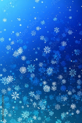 Falling snowflakes on blue winter background creating pattern