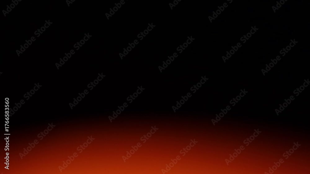 Una toma de cerca de un fondo abstracto de color anaranjado con negro  con un degradado ligero desenfocado en movimiento. 