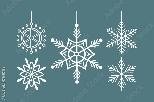 hanging snowflake ornaments on teal background for winter decoration