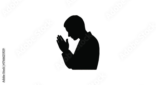 Silhouette of a person praying with hands clasped in quiet contemplation