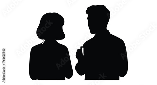 Silhouettes of a couple engaged in a quiet moment, highlighting connection and intimacy.