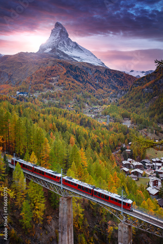 Zermatt, Switzerland. Image of Swiss Alps with Gornergrad tourist train and Matterhorn in Valais region at autumn sunset.