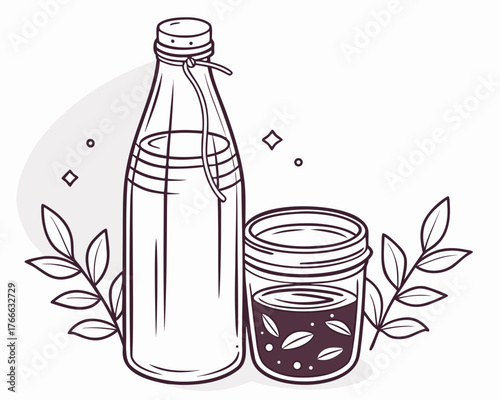 Elegant glass bottle and jar with leaves