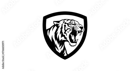 A black and white illustration of a roaring tiger's head inside a shield emblem.