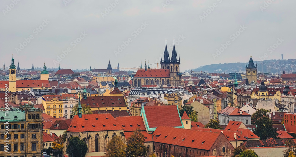 Obraz premium Prague Historic Cityscape Church Spires Terracotta Rooftops Urban Architecture Czech Republic Skyline Aerial View Panorama. Autumn Background 