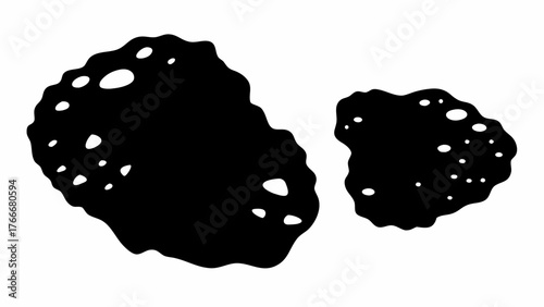 Two irregular black shapes with white spots scattered across their surfaces on a white background