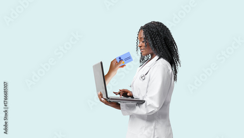 Portrait of confident young medical woman doctor with laptop on white background