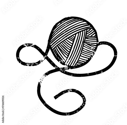 Yarn ball unravels in crafting scene