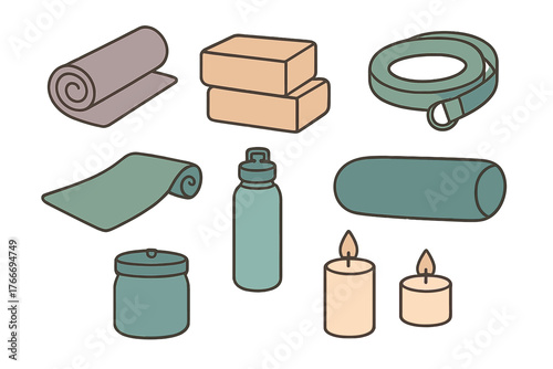 Collection of essential yoga and fitness accessories including mats, blocks, strap, and candles