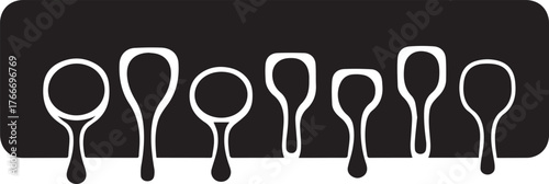 Collection of stylized white spoons of various sizes and shapes against a black background kitchen utensil