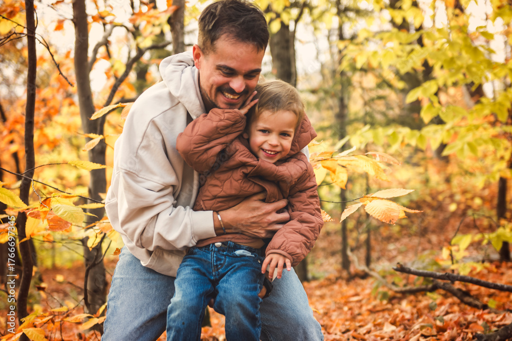 Fototapeta premium father with little boy in autumn beautiful forest