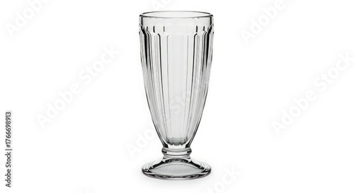 A clear glass milkshake glass with vertical ridges and a pedestal base, isolated on a white background.