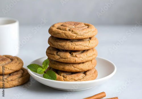 A realistic photo of a stack of warm, spiced snickerdoodle cookies dusted with cinnamon and sugar.