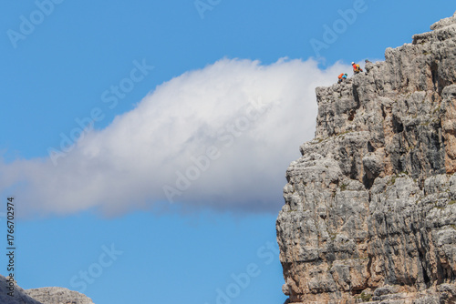 Rock climber on top of Cinque Tori (Dolomites)