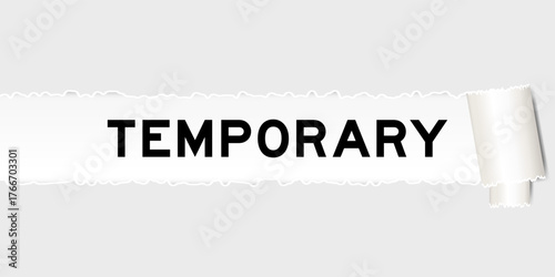 Ripped gray paper background that have word temporary under torn part