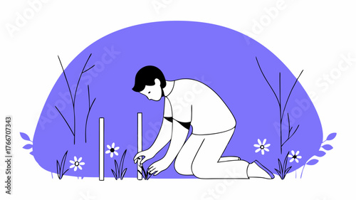 A volunteer marking the spots where trees will be planted using biodegradable stakes in a green space filled with bright wildflowers.