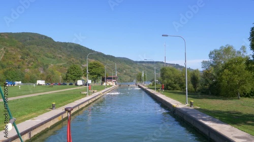 Scenic view of a ship navigating the canal lock system on the moselle river