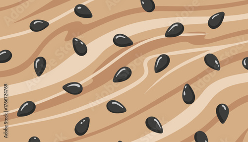 Close-up shot of black sesame seeds scattered across a textured wooden background with swirling brown and beige lines, creating a visually appealing and organic pattern perfect for food-related