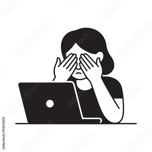 Woman with eyes covered sitting in front of a laptop computer