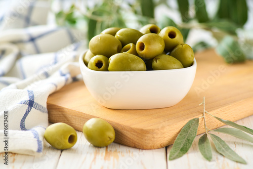 Wallpaper Mural pitted olives in a bowl with fresh olive leaves. Greens pitted olives on a white wooden table. Torontodigital.ca