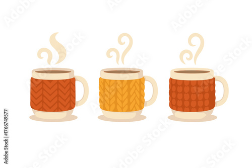 Three hot beverage mugs with textured knitted sweater sleeves in warm colors