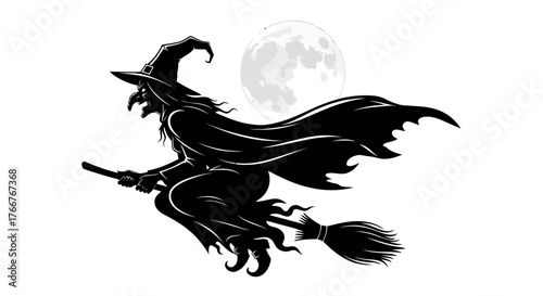 Mysterious black silhouette of a wicked witch flying on her broomstick in front of a large, glowing full moon on a spooky Halloween night