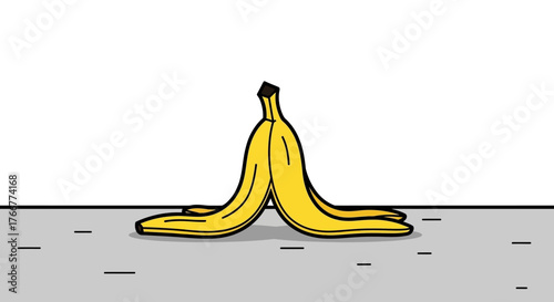 Yellow banana peel lying on the ground, isolated on, representing slippery hazard or comical accident