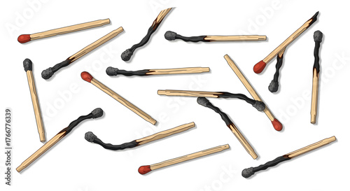 Scattered used and unused matches with burnt ends, representing fire, energy, or potential