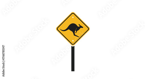 Yellow diamondshaped road sign with black silhouette kangaroo, indicating wildlife crossing
